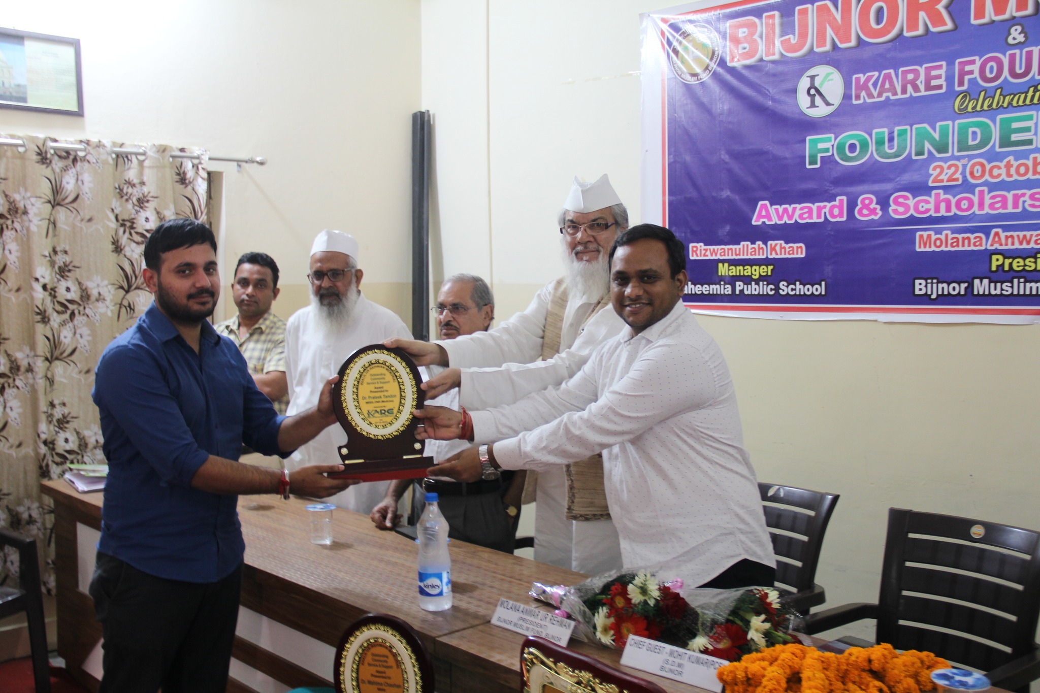 Previous year Founder's Day - Presenting scholarship trophy at award ceremony